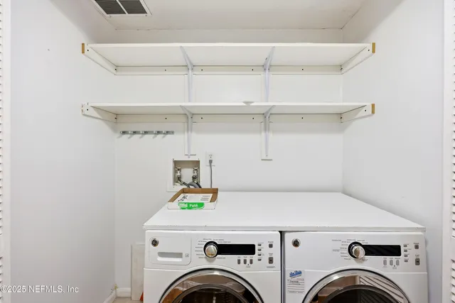 a utility room with dryer and washer