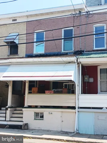 a stove top oven sitting inside of a kitchen