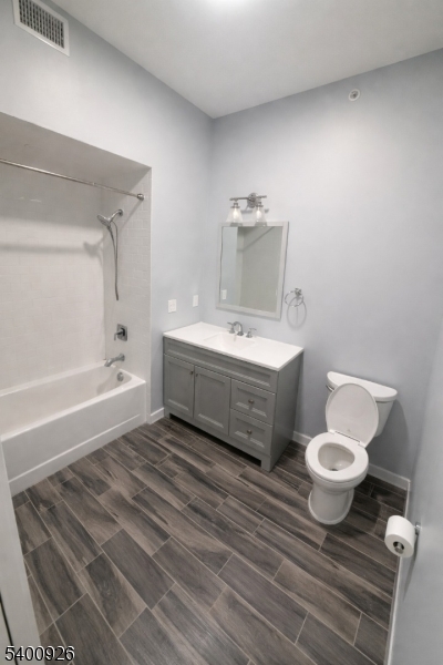 391 Springfield Avenue, Unit 2A Berkeley Heights, NJ 07922 - Photo 3 of 8 a bathroom with a sink toilet and shower