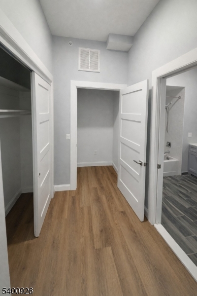 391 Springfield Avenue, Unit 2A Berkeley Heights, NJ 07922 - Photo 4 of 8 a view of a room with wooden floor