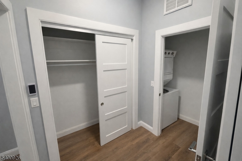 391 Springfield Avenue, Unit 2A Berkeley Heights, NJ 07922 - Photo 5 of 8 a view of walk in closet with wooden floor