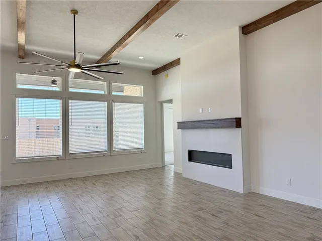 a bathroom with a double vanity sink a mirror and a bathtub