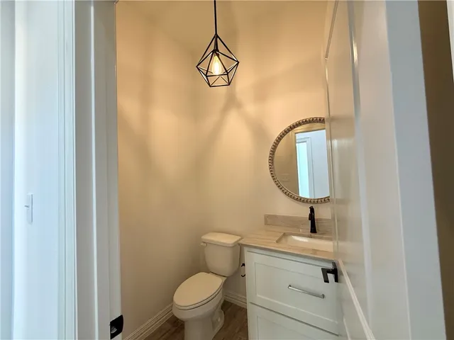 an empty room with a ceiling fan and window