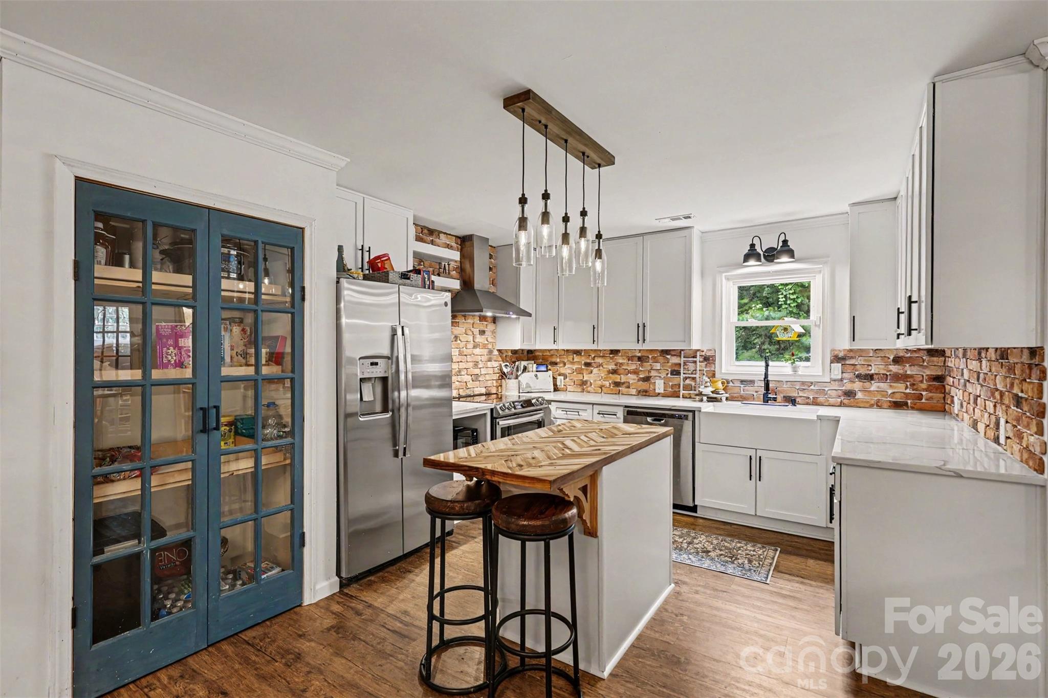 184 Canal Road Belmont, NC 28012 - Photo 27 of 39 a kitchen with stainless steel appliances granite countertop a refrigerator and a stove top oven