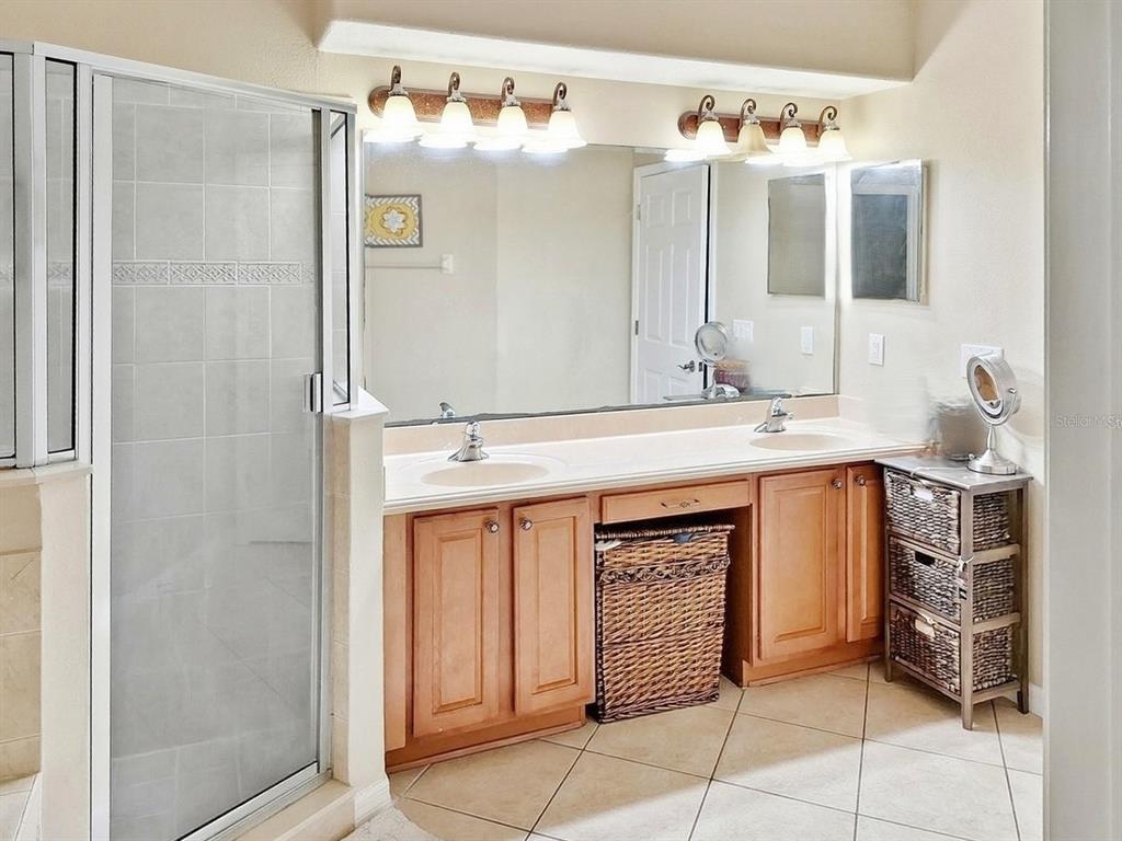 2056 Clapper Trail Apopka, FL 32703 - Photo 13 of 14 a bathroom with a granite countertop sink and a mirror