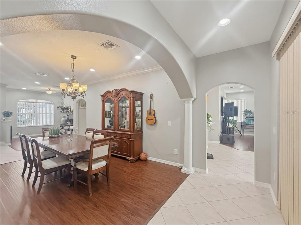 2056 Clapper Trail Apopka, FL 32703 - Photo 3 of 14 a view of a a dining room with furniture and chandelier