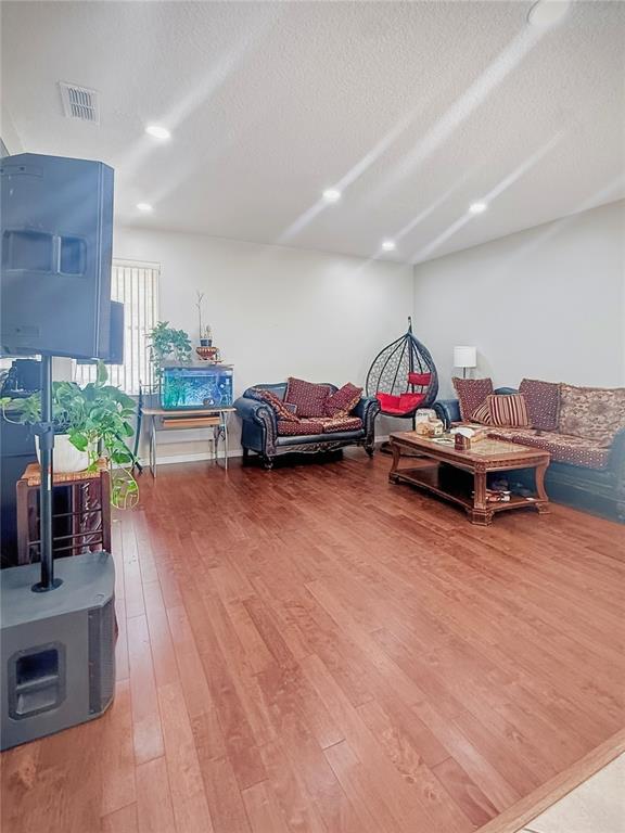 2056 Clapper Trail Apopka, FL 32703 - Photo 4 of 14 a living room with furniture and a wooden floor