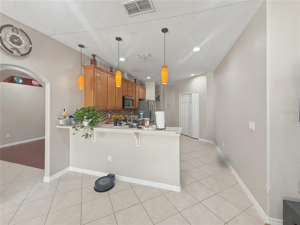2056 Clapper Trail Apopka, FL 32703 - Photo 7 of 14 a view of kitchen with stainless steel appliances granite countertop window