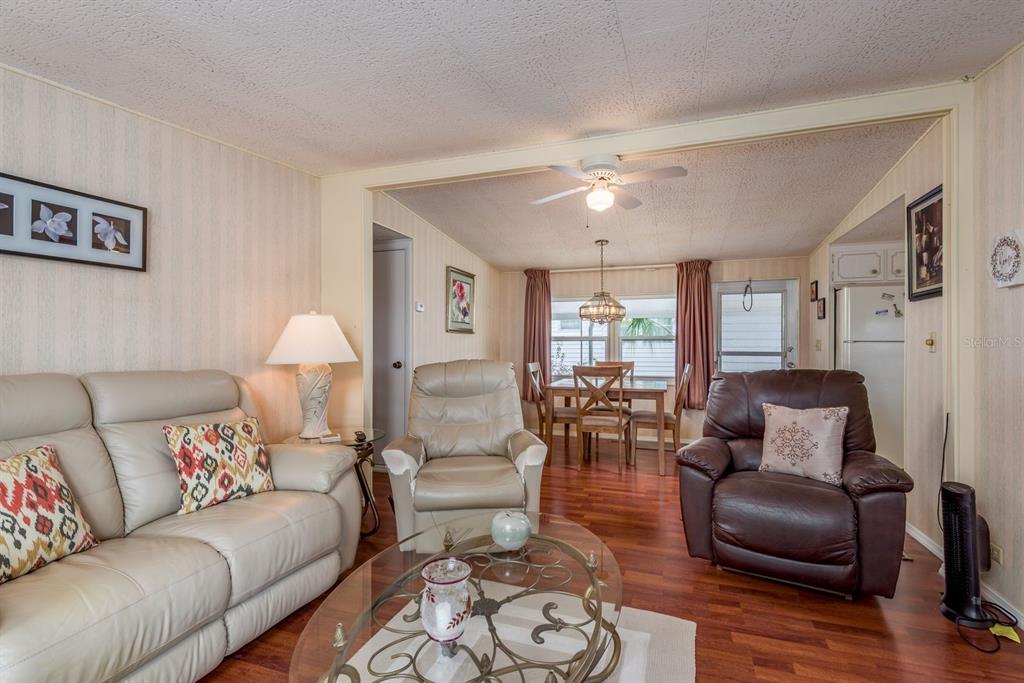 2331 Belleair Road, Unit 514 Clearwater, FL 33764 - Photo 12 of 39 a living room with furniture and wooden floor