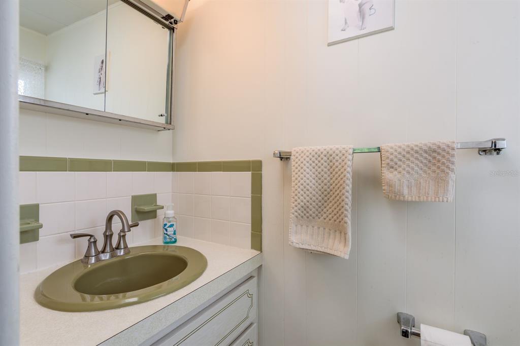 2331 Belleair Road, Unit 514 Clearwater, FL 33764 - Photo 15 of 39 a bathroom with a sink and a mirror