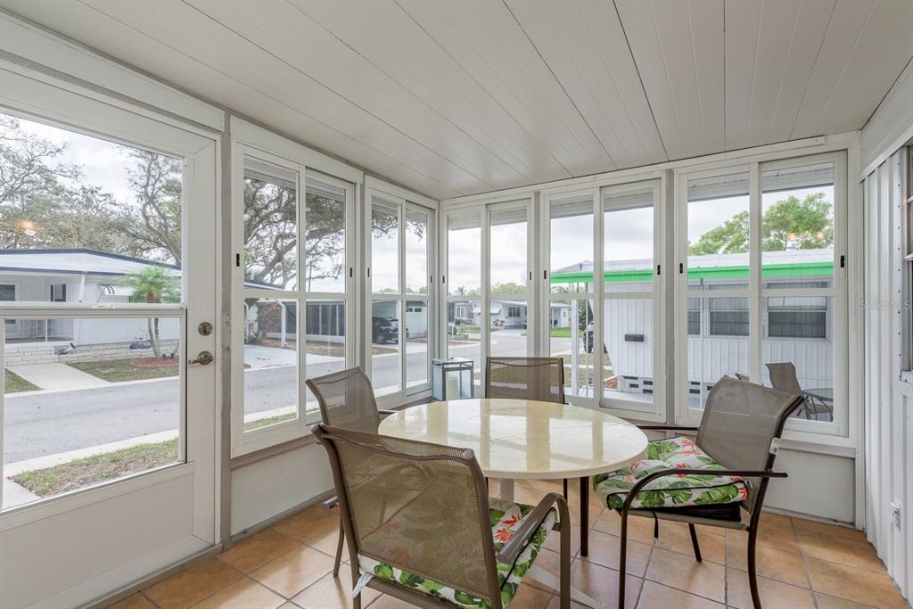 2331 Belleair Road, Unit 514 Clearwater, FL 33764 - Photo 20 of 39 a dining room with furniture water view and a floor to ceiling window
