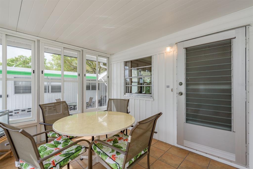 2331 Belleair Road, Unit 514 Clearwater, FL 33764 - Photo 21 of 39 a view of a dining room with furniture window and outside view