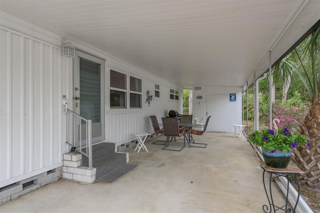 2331 Belleair Road, Unit 514 Clearwater, FL 33764 - Photo 22 of 39 a dining room with furniture and a potted plant