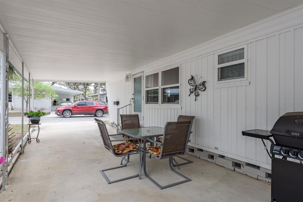 2331 Belleair Road, Unit 514 Clearwater, FL 33764 - Photo 24 of 39 a dining room with furniture and a window