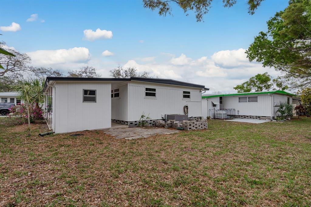 2331 Belleair Road, Unit 514 Clearwater, FL 33764 - Photo 27 of 39 a view of a house with backyard and garden