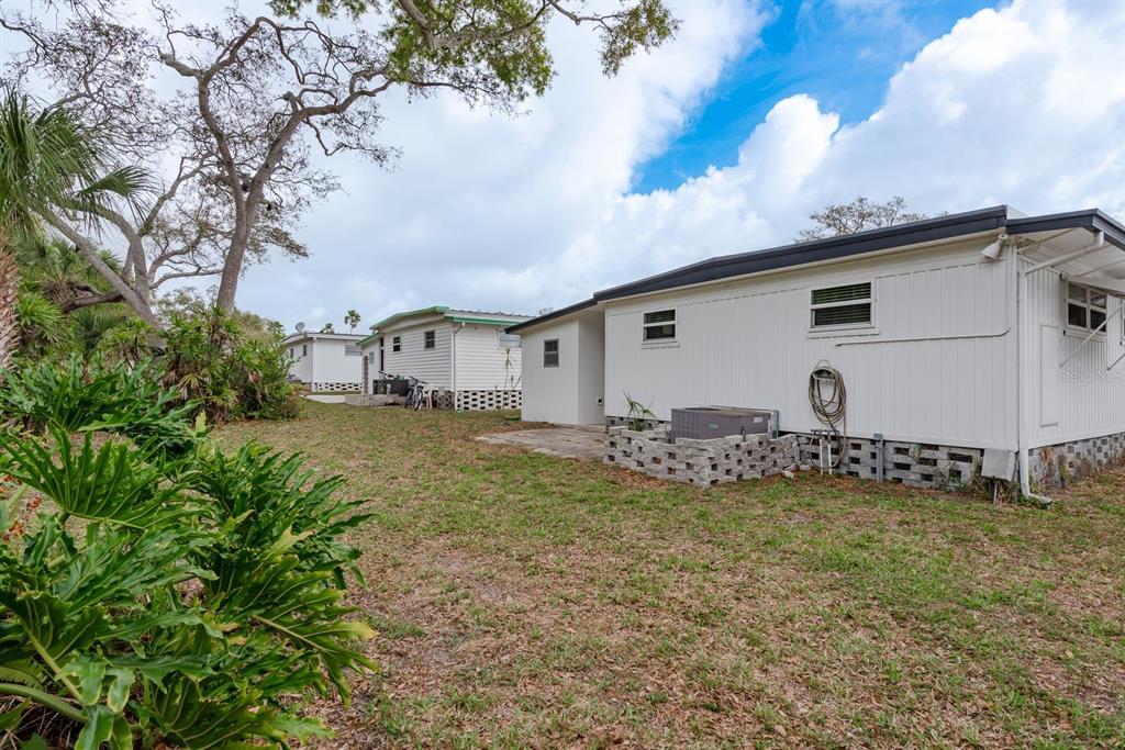 2331 Belleair Road, Unit 514 Clearwater, FL 33764 - Photo 28 of 39 a view of a house with backyard
