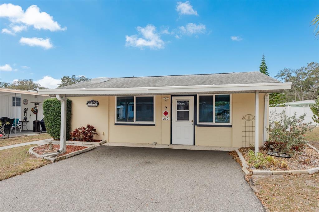 2331 Belleair Road, Unit 514 Clearwater, FL 33764 - Photo 32 of 39 a front view of a house with a sitting area