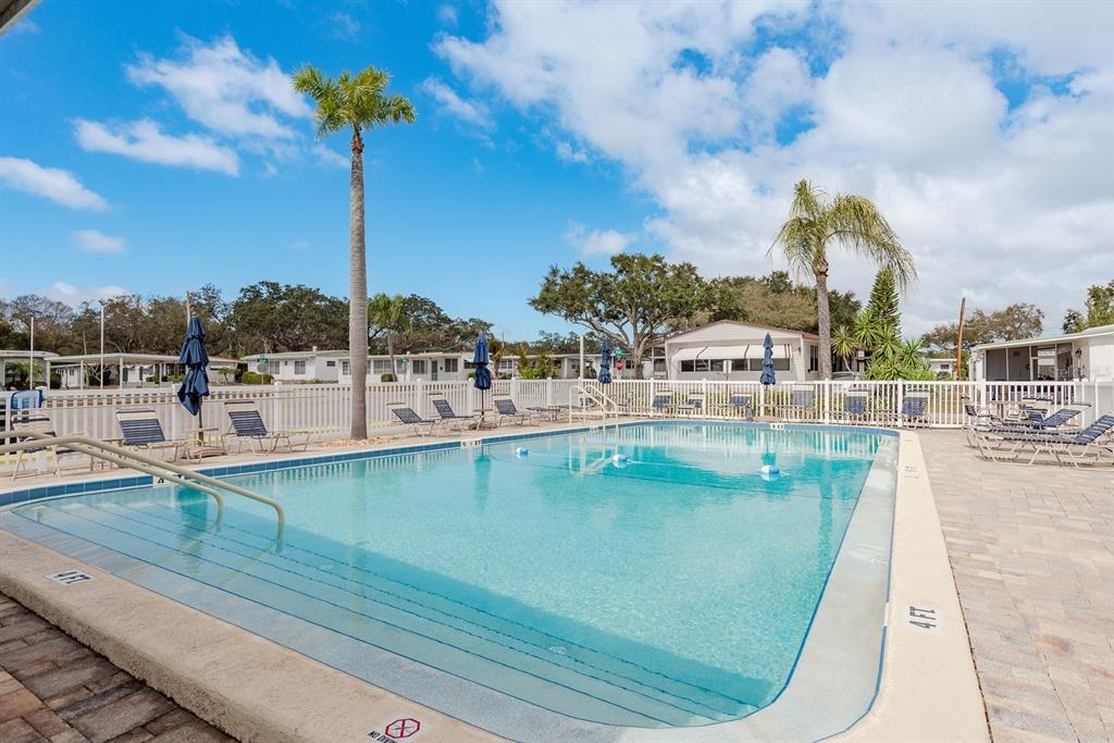 2331 Belleair Road, Unit 514 Clearwater, FL 33764 - Photo 37 of 39 a view of a swimming pool with a terrace