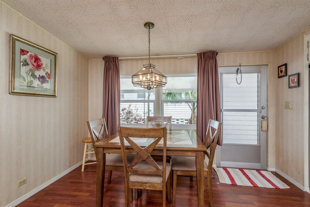 2331 Belleair Road, Unit 514 Clearwater, FL 33764 - Photo 5 of 39 a view of a dining room with furniture window and wooden floor
