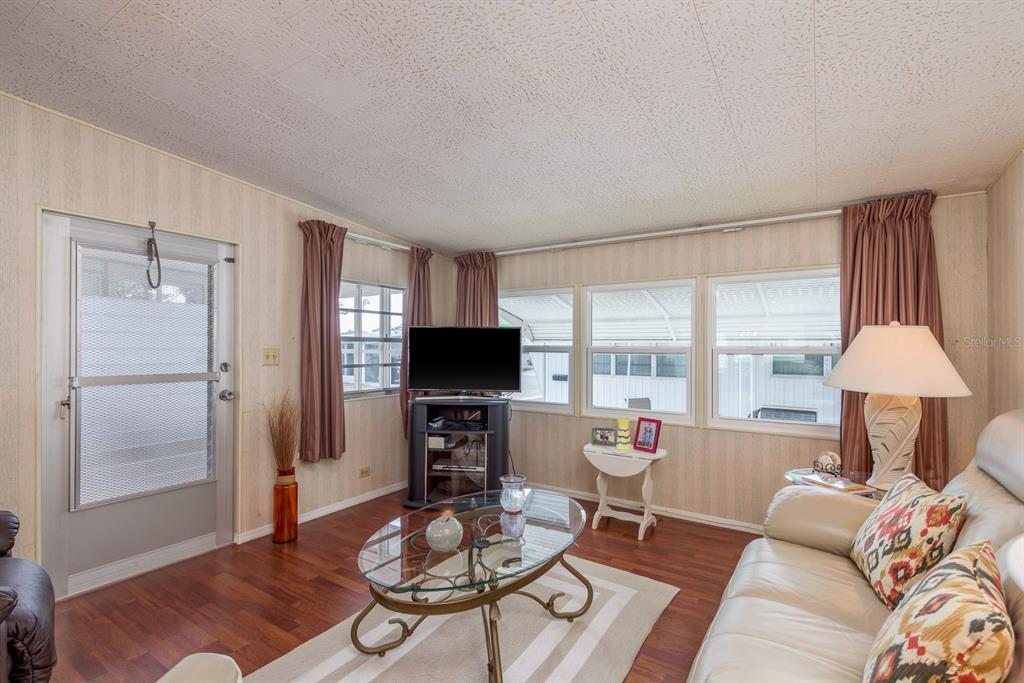 2331 Belleair Road, Unit 514 Clearwater, FL 33764 - Photo 10 of 39 a living room with furniture and a window