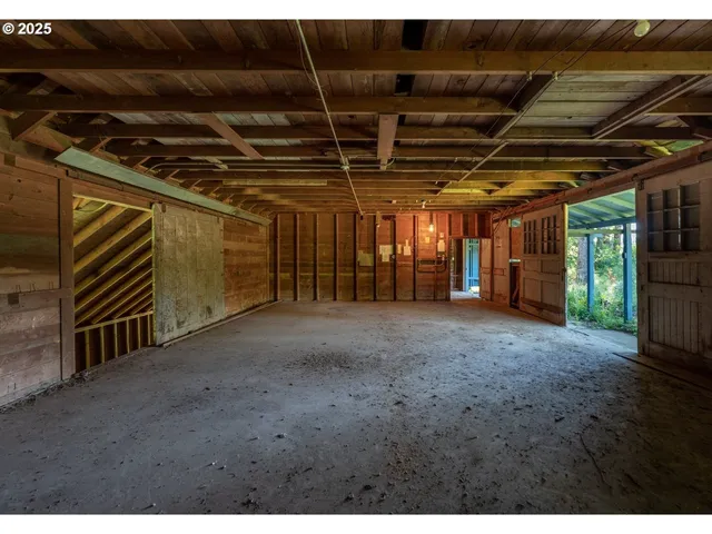 a view of an empty room with wooden walls