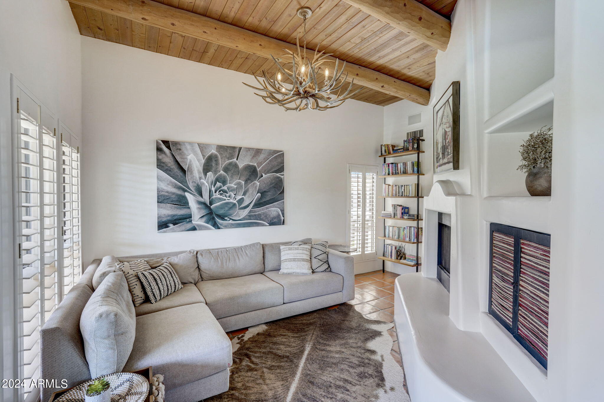 10468 East Quartz Rock Road Scottsdale, AZ 85255 - Photo 14 of 58 a living room with furniture and a chandelier