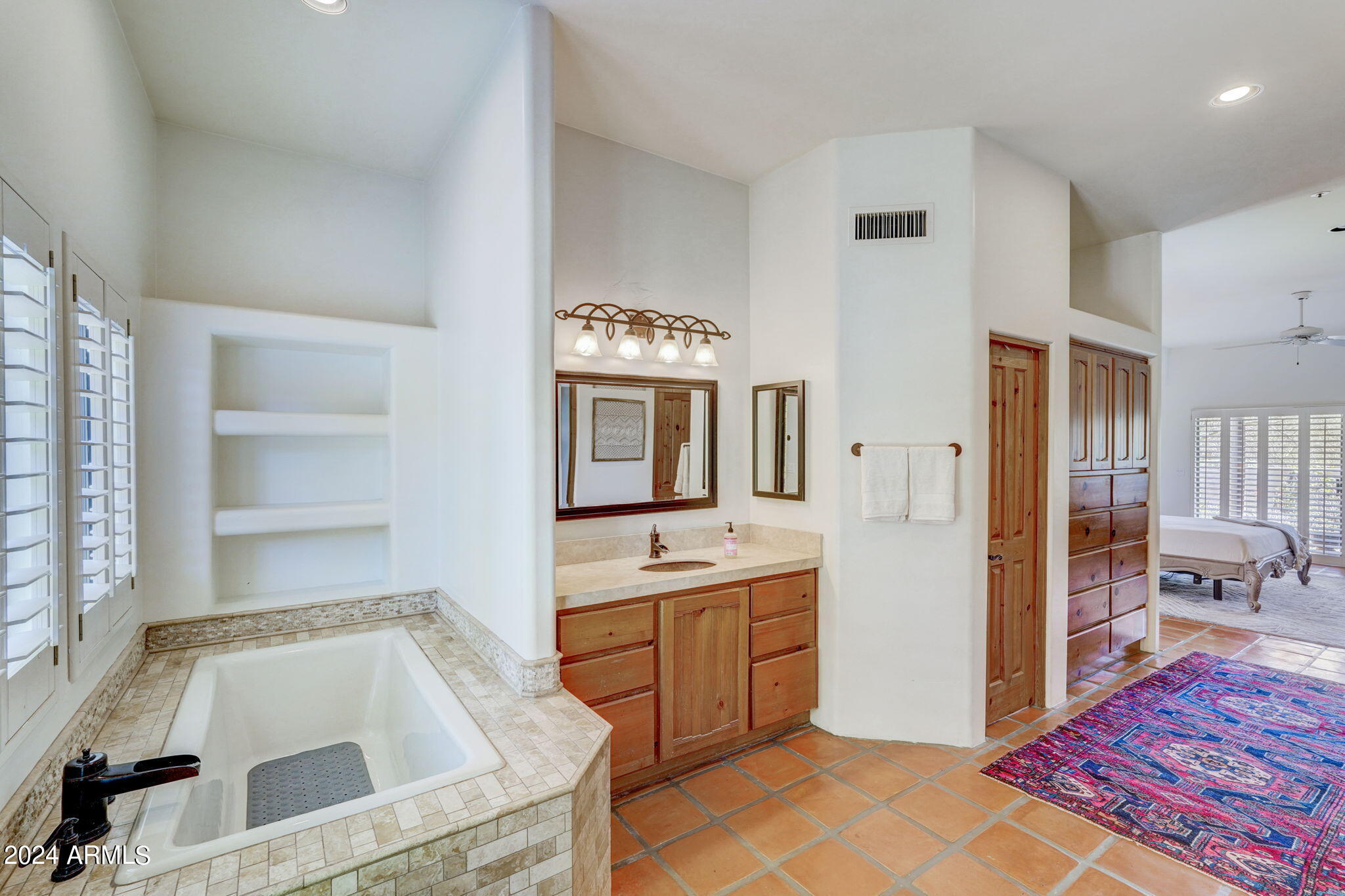 10468 East Quartz Rock Road Scottsdale, AZ 85255 - Photo 18 of 58 a bathroom with a sink and a bathtub
