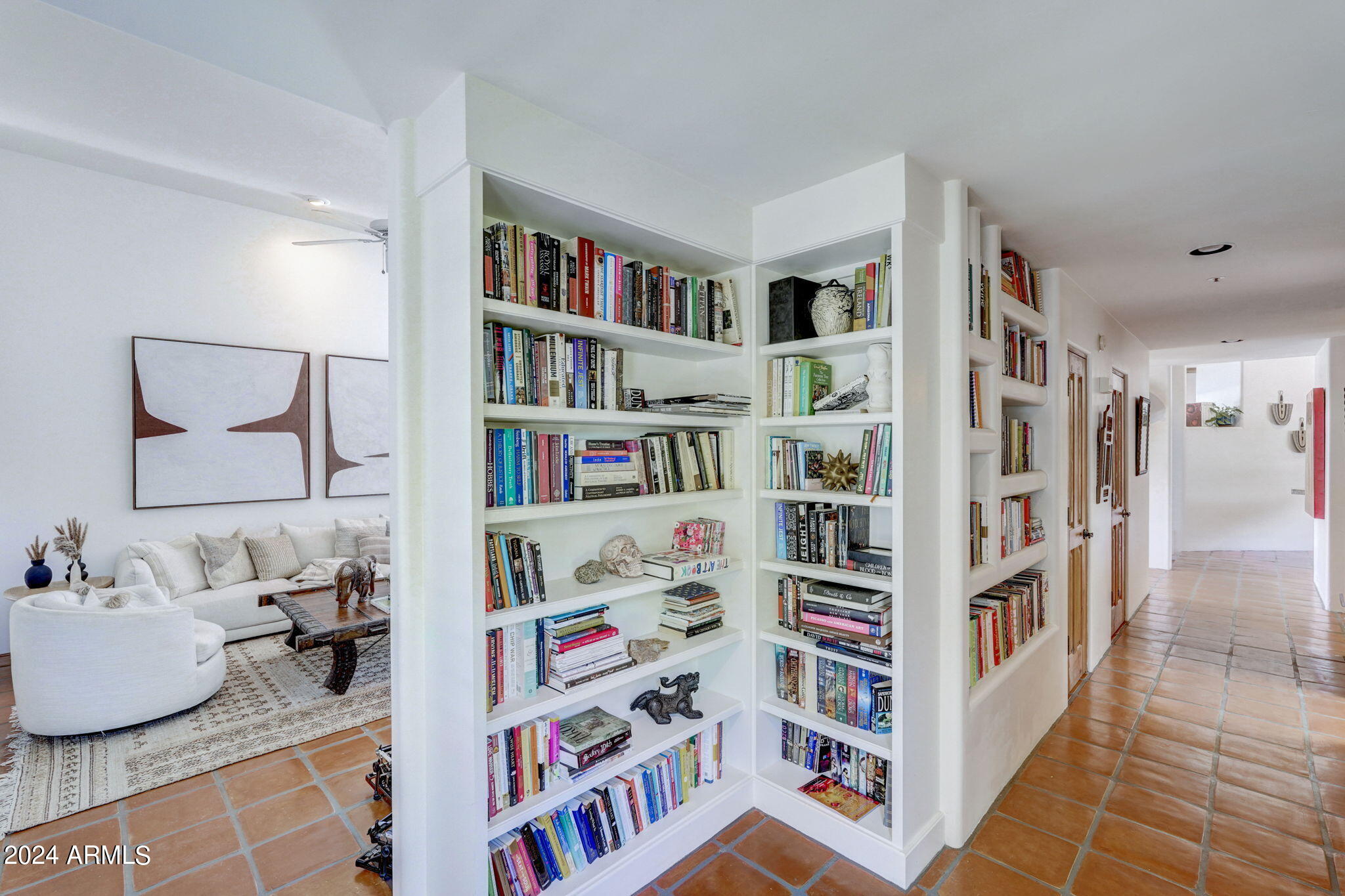 10468 East Quartz Rock Road Scottsdale, AZ 85255 - Photo 20 of 58 a room with a book shelf and a book shelf