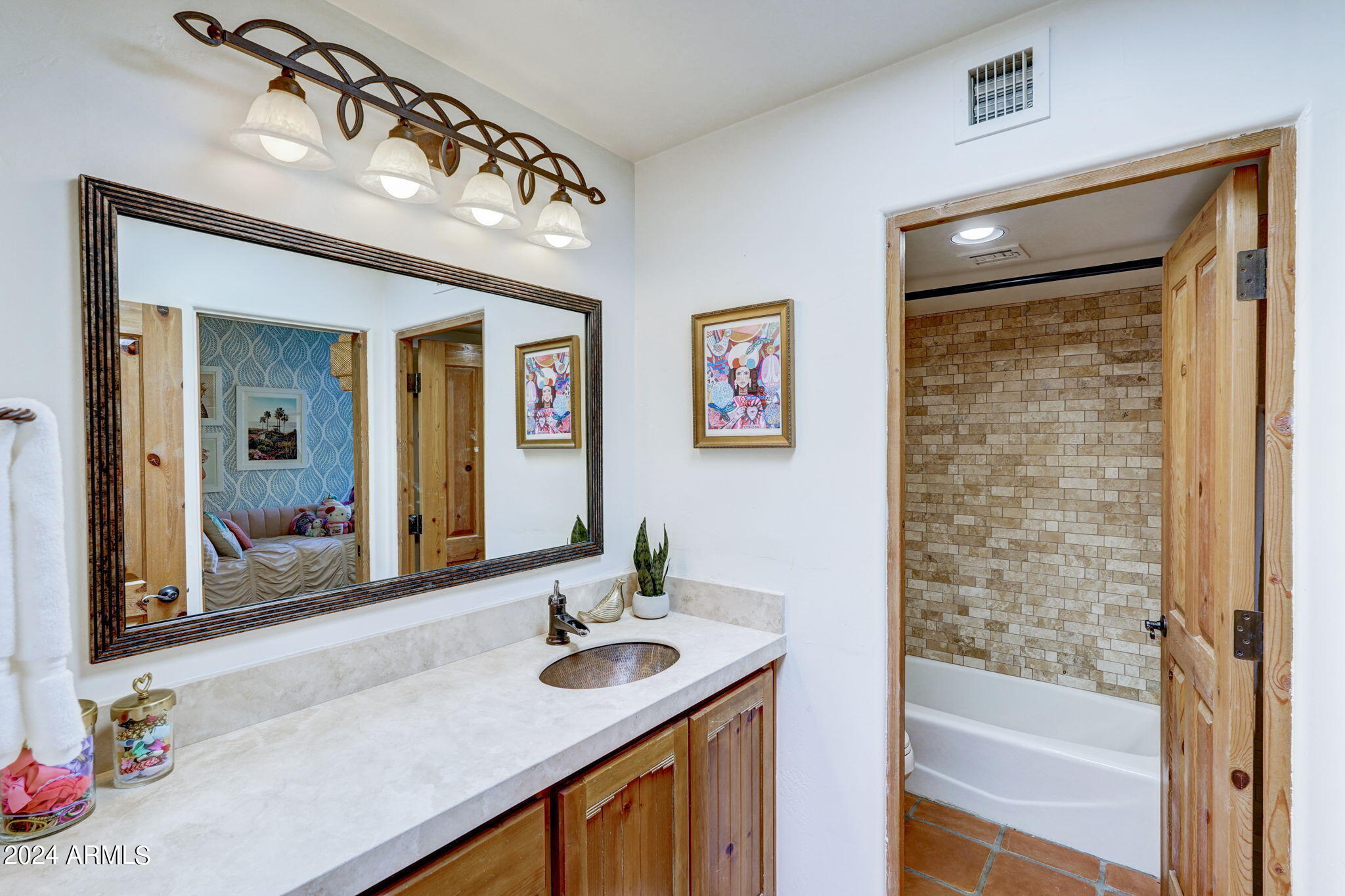 10468 East Quartz Rock Road Scottsdale, AZ 85255 - Photo 24 of 58 a bathroom with a sink a vanity and a mirror