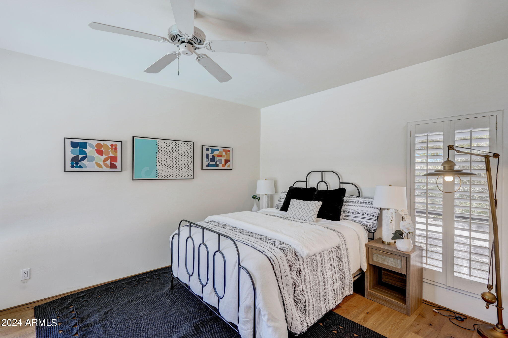 10468 East Quartz Rock Road Scottsdale, AZ 85255 - Photo 29 of 58 a bedroom with a bed and a window