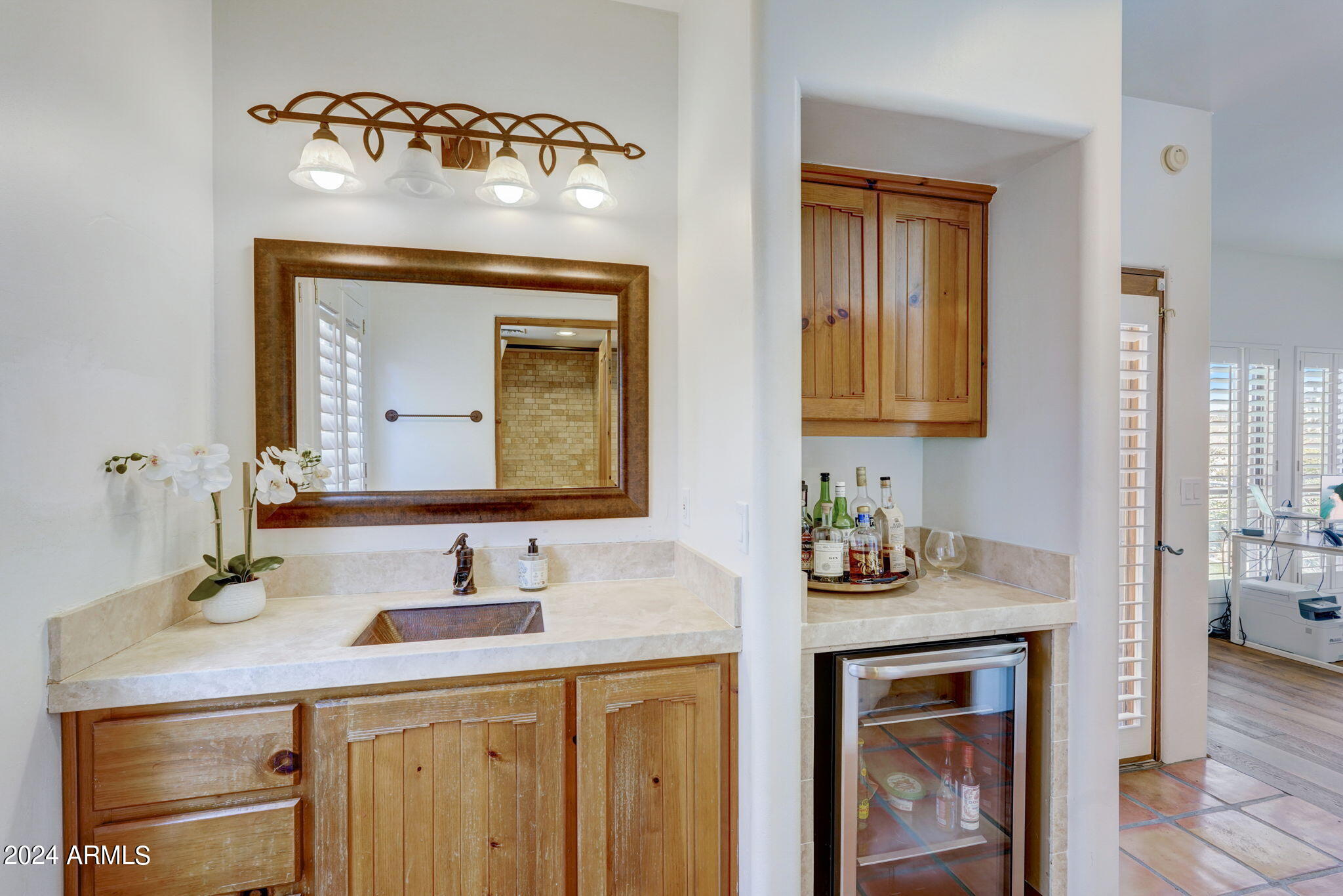 10468 East Quartz Rock Road Scottsdale, AZ 85255 - Photo 33 of 58 a bathroom with a sink and a mirror