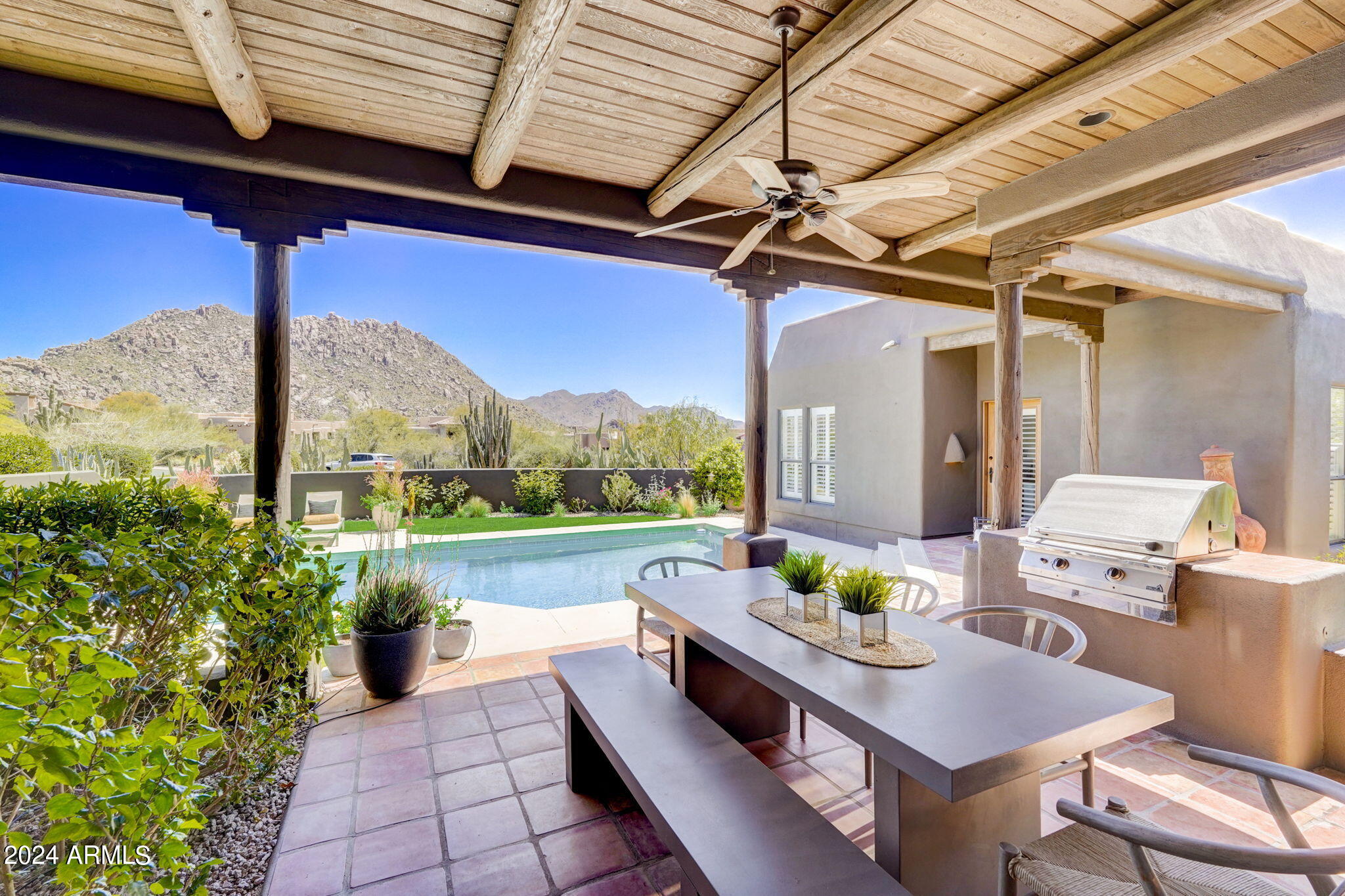 10468 East Quartz Rock Road Scottsdale, AZ 85255 - Photo 35 of 58 a balcony with furniture and a potted plant
