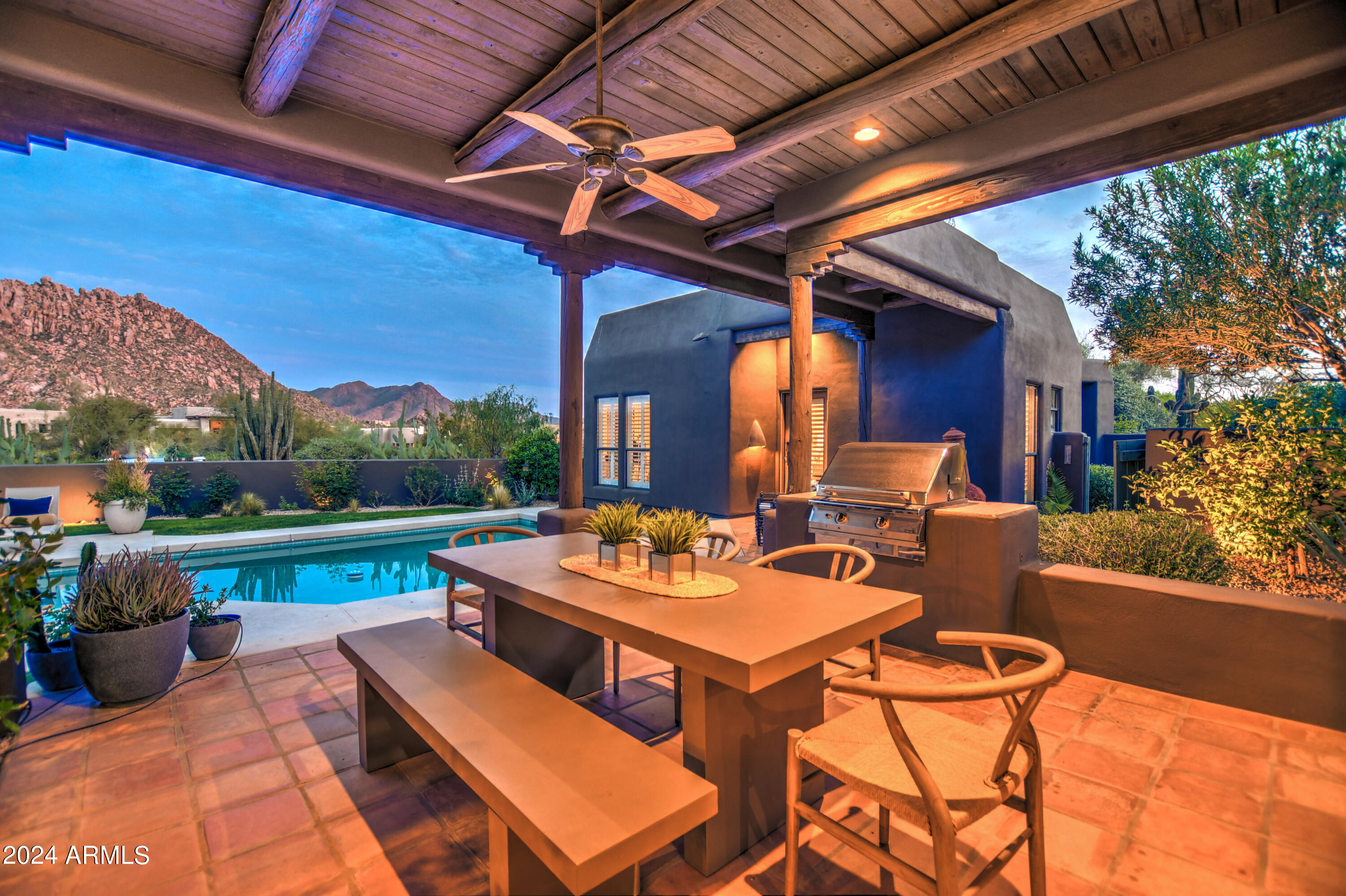 10468 East Quartz Rock Road Scottsdale, AZ 85255 - Photo 43 of 58 a view of a patio with couches table and chairs