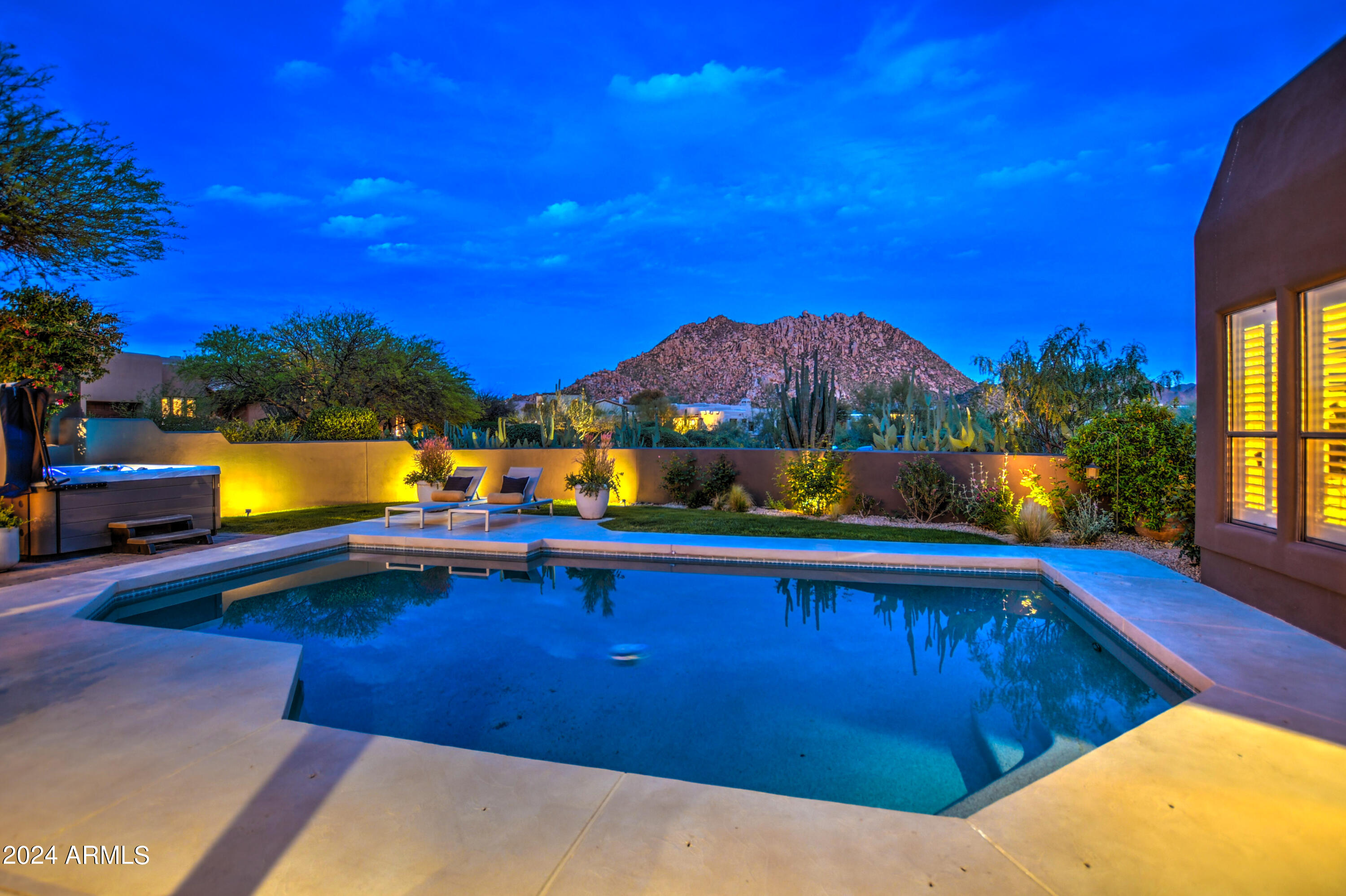 10468 East Quartz Rock Road Scottsdale, AZ 85255 - Photo 48 of 58 a view of swimming pool with a table and chairs under an umbrella