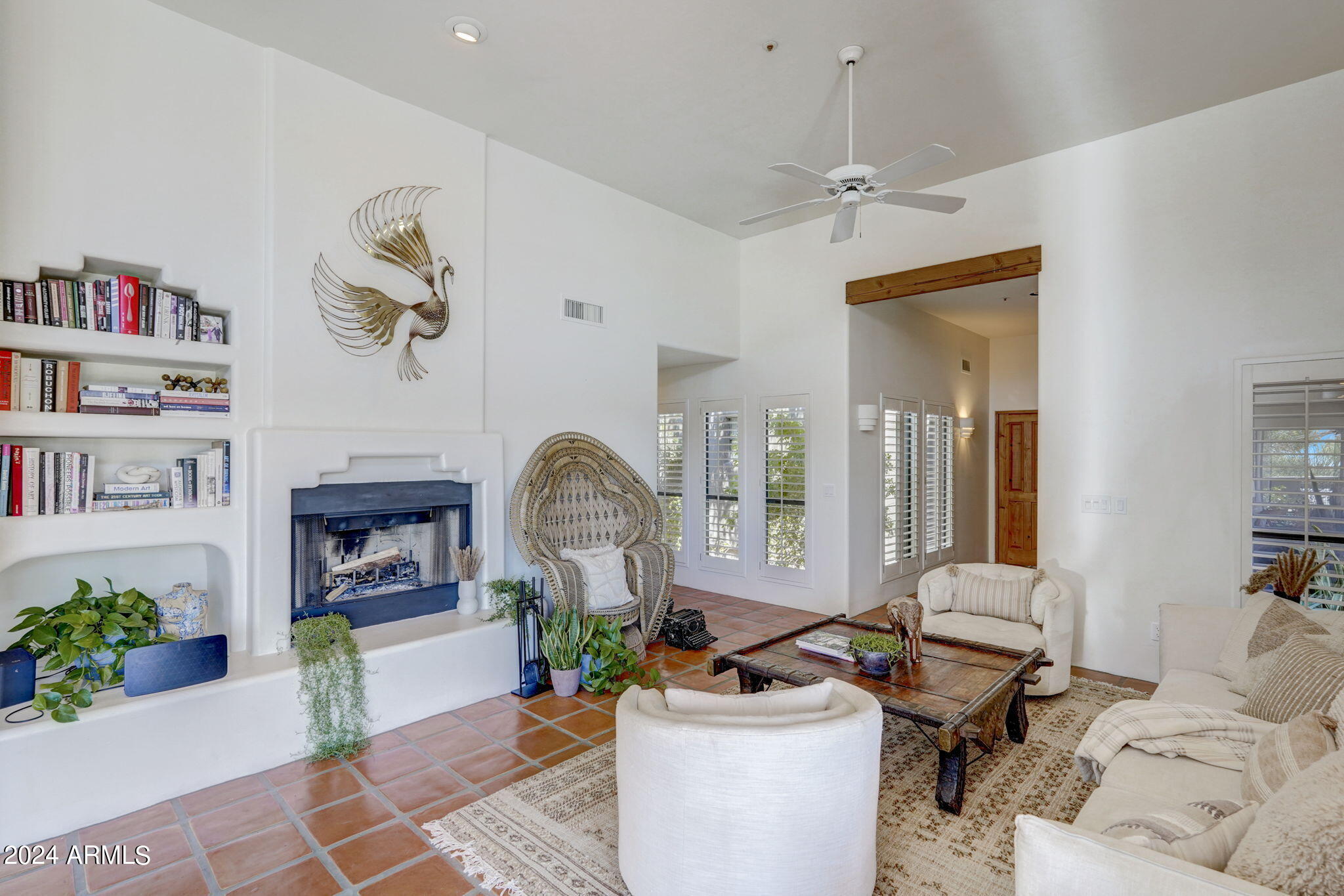 10468 East Quartz Rock Road Scottsdale, AZ 85255 - Photo 9 of 58 a living room with furniture and a potted plant