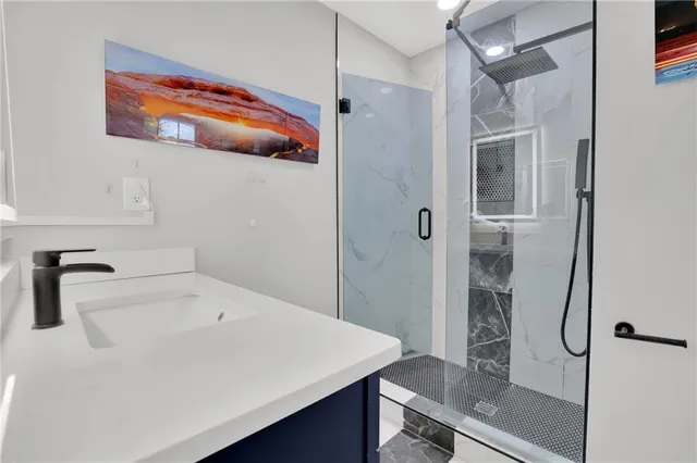 a bathroom with a sink and a shower