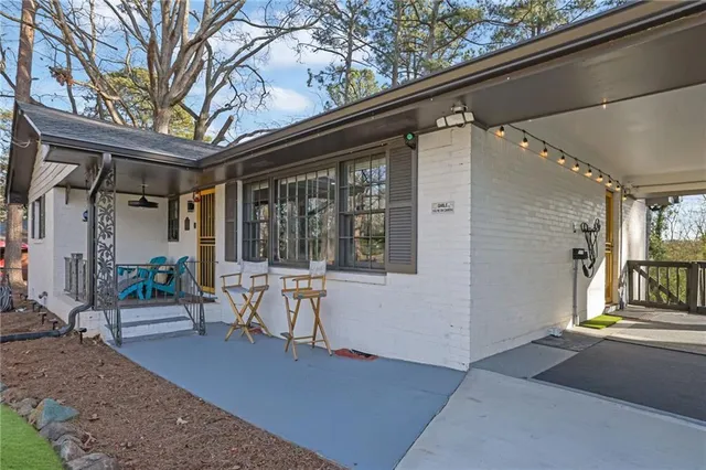a view of a house with chairs in patio