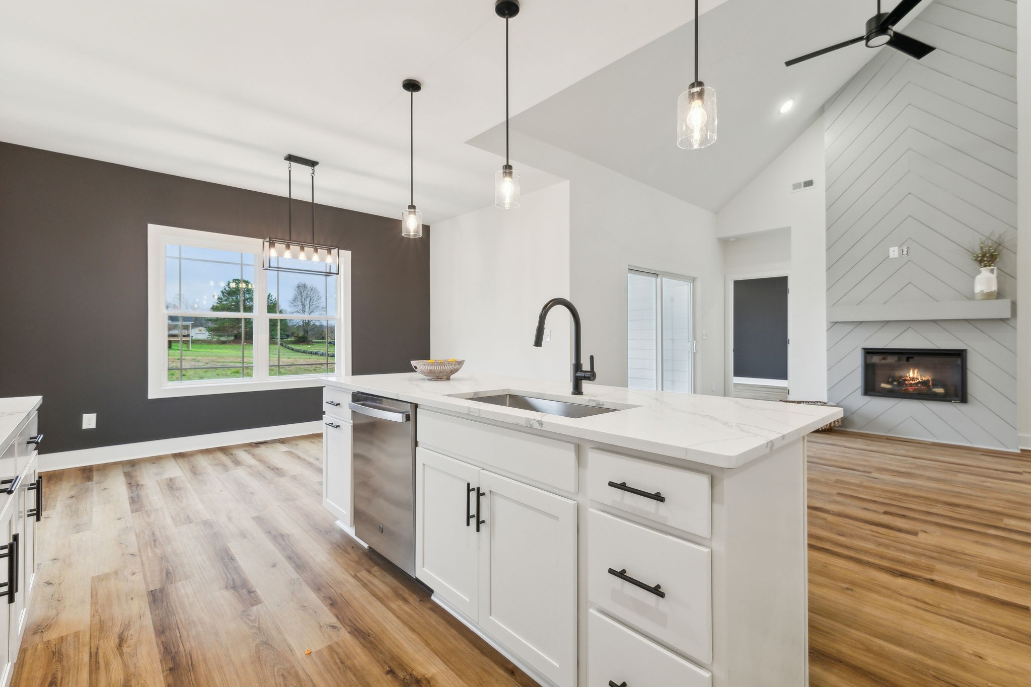 6453 Hopewell Road Springfield, TN 37172 - Photo 13 of 49 a view of a kitchen with a sink wooden floor and windows
