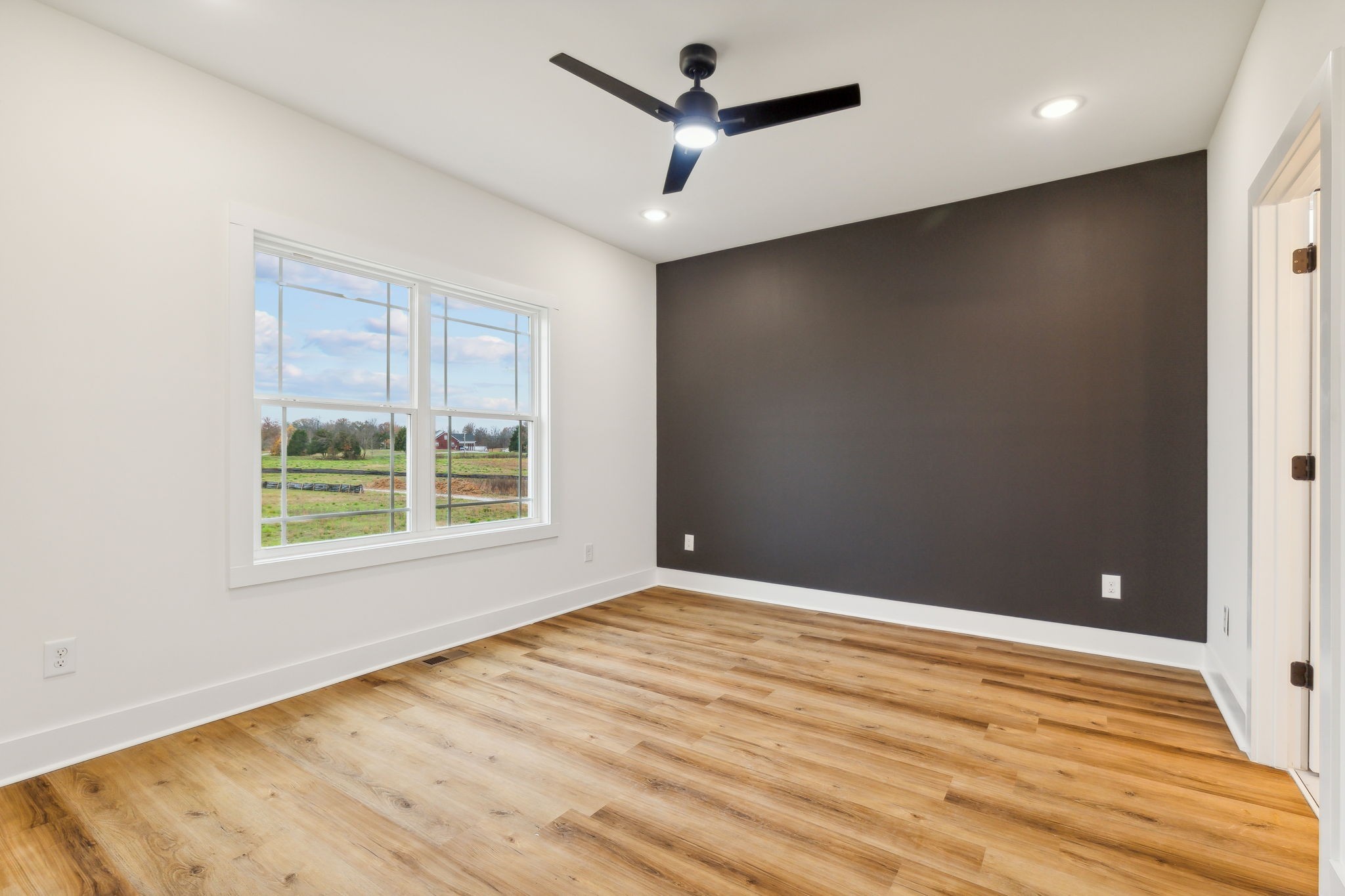 6453 Hopewell Road Springfield, TN 37172 - Photo 18 of 49 a view of empty room with wooden floor and fan