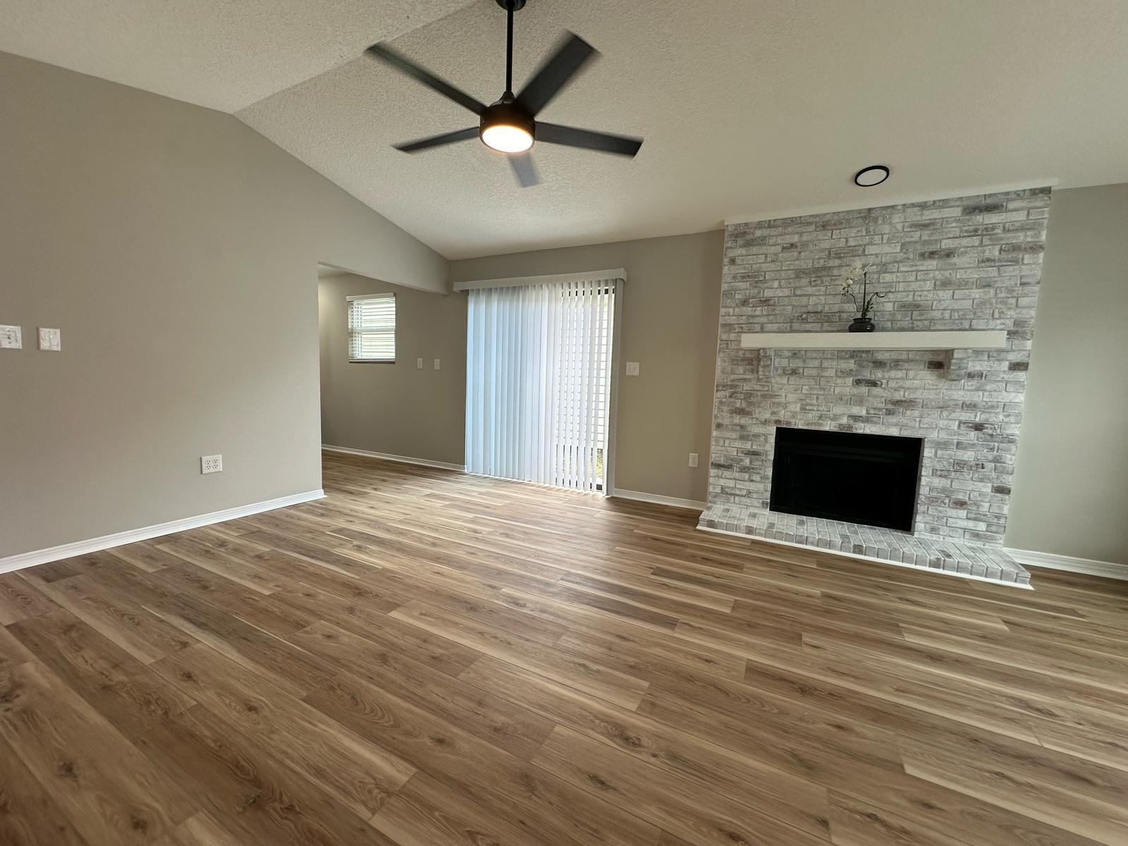 1 Kelly Way Valparaiso, FL 32580 - Photo 12 of 18 wooden floor in an empty room with a fireplace