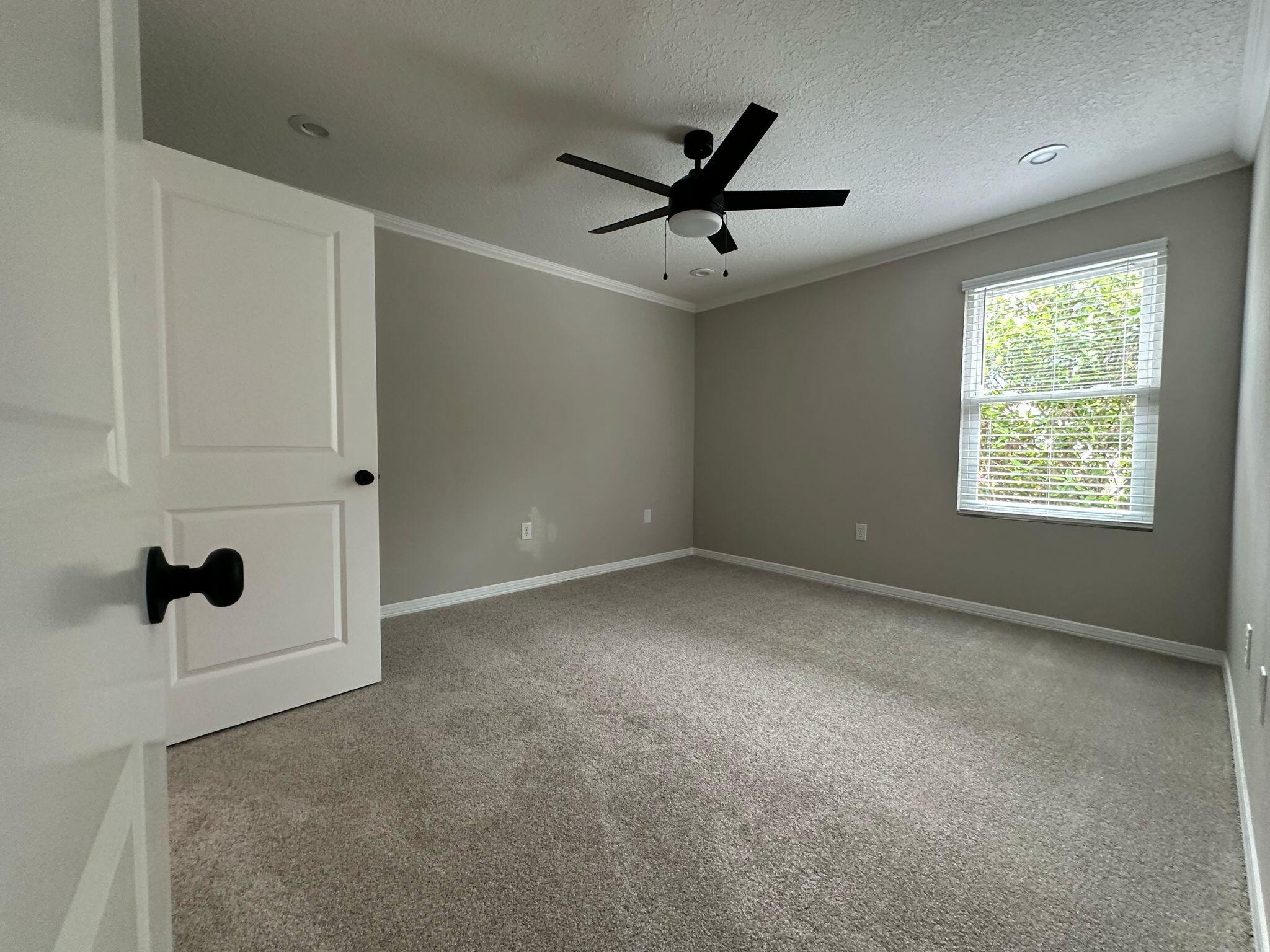 1 Kelly Way Valparaiso, FL 32580 - Photo 16 of 18 a view of a livingroom with a ceiling fan & windows
