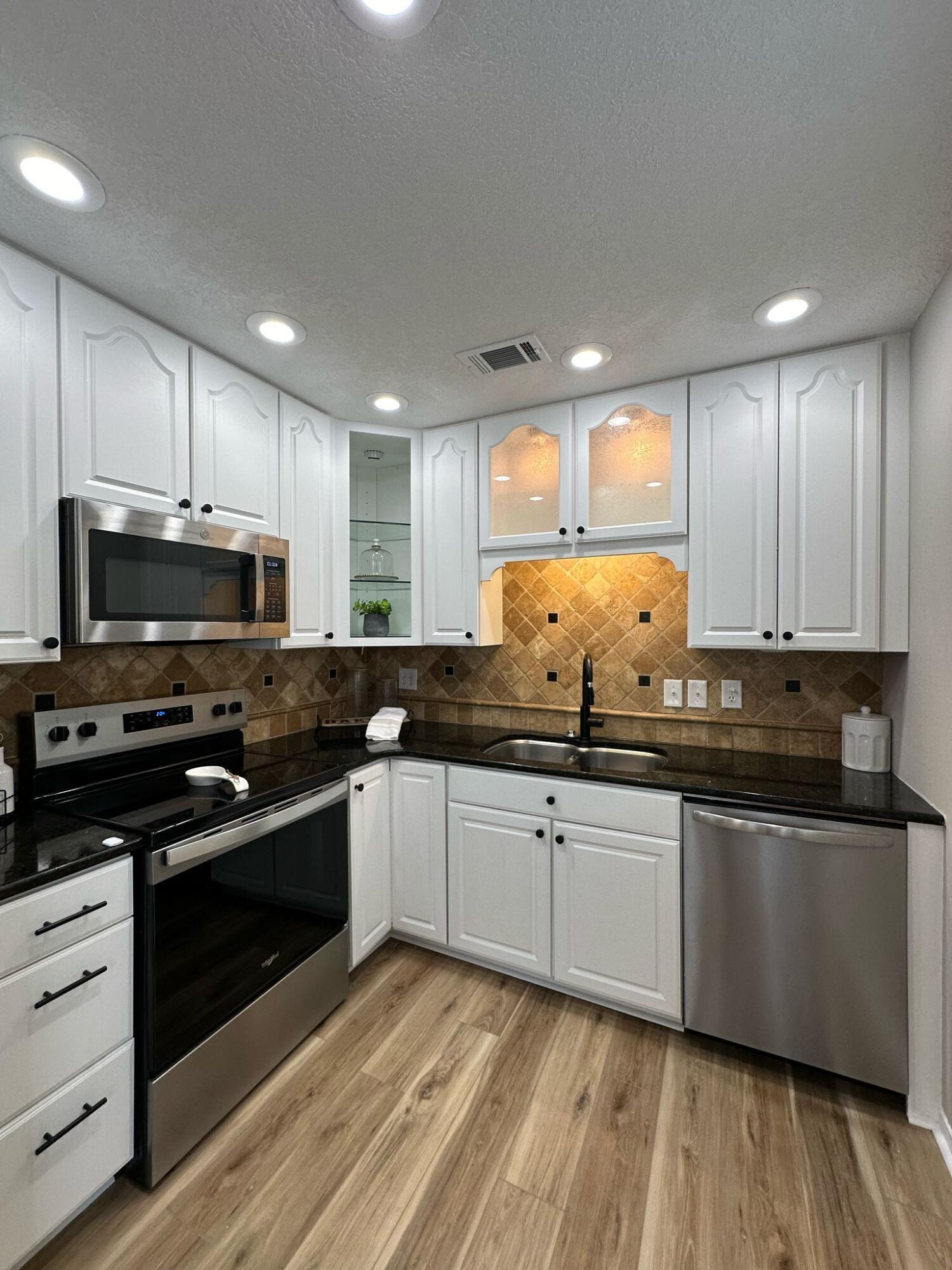 1 Kelly Way Valparaiso, FL 32580 - Photo 3 of 18 a kitchen with granite countertop a sink and steel appliances