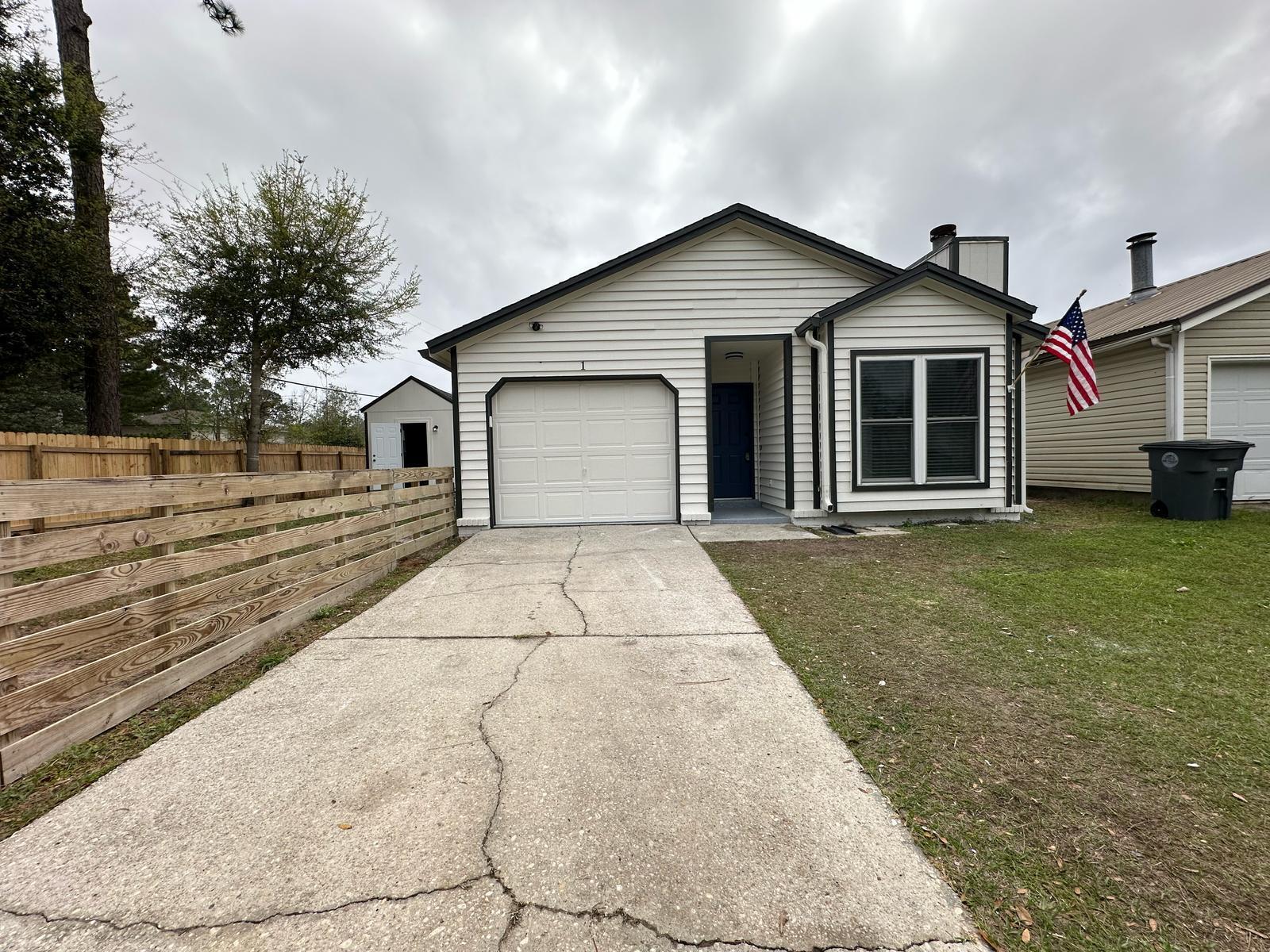 1 Kelly Way Valparaiso, FL 32580 - Photo 4 of 18 a front view of a house with a yard and trees