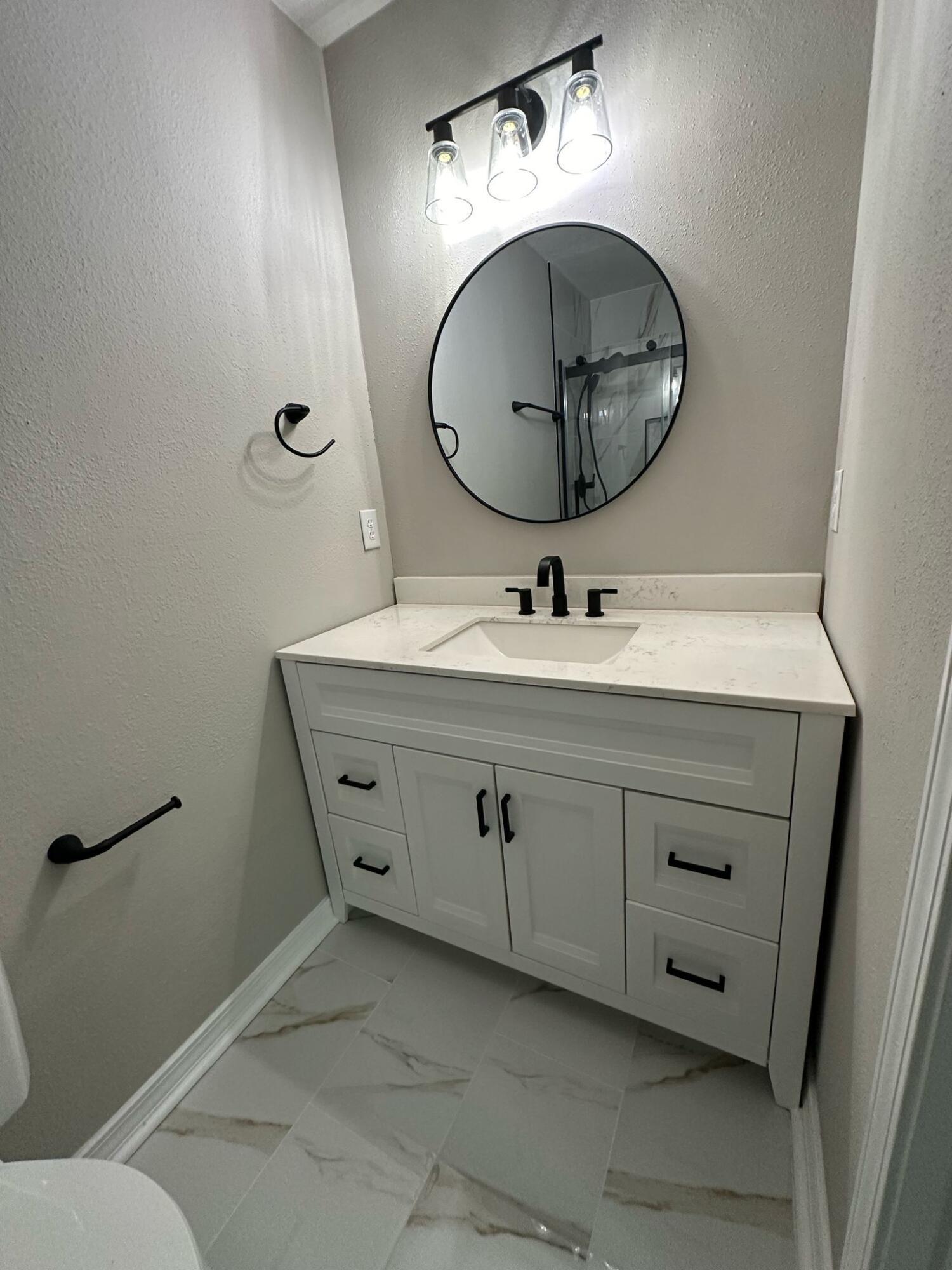 1 Kelly Way Valparaiso, FL 32580 - Photo 6 of 18 a bathroom with a sink mirror and vanity