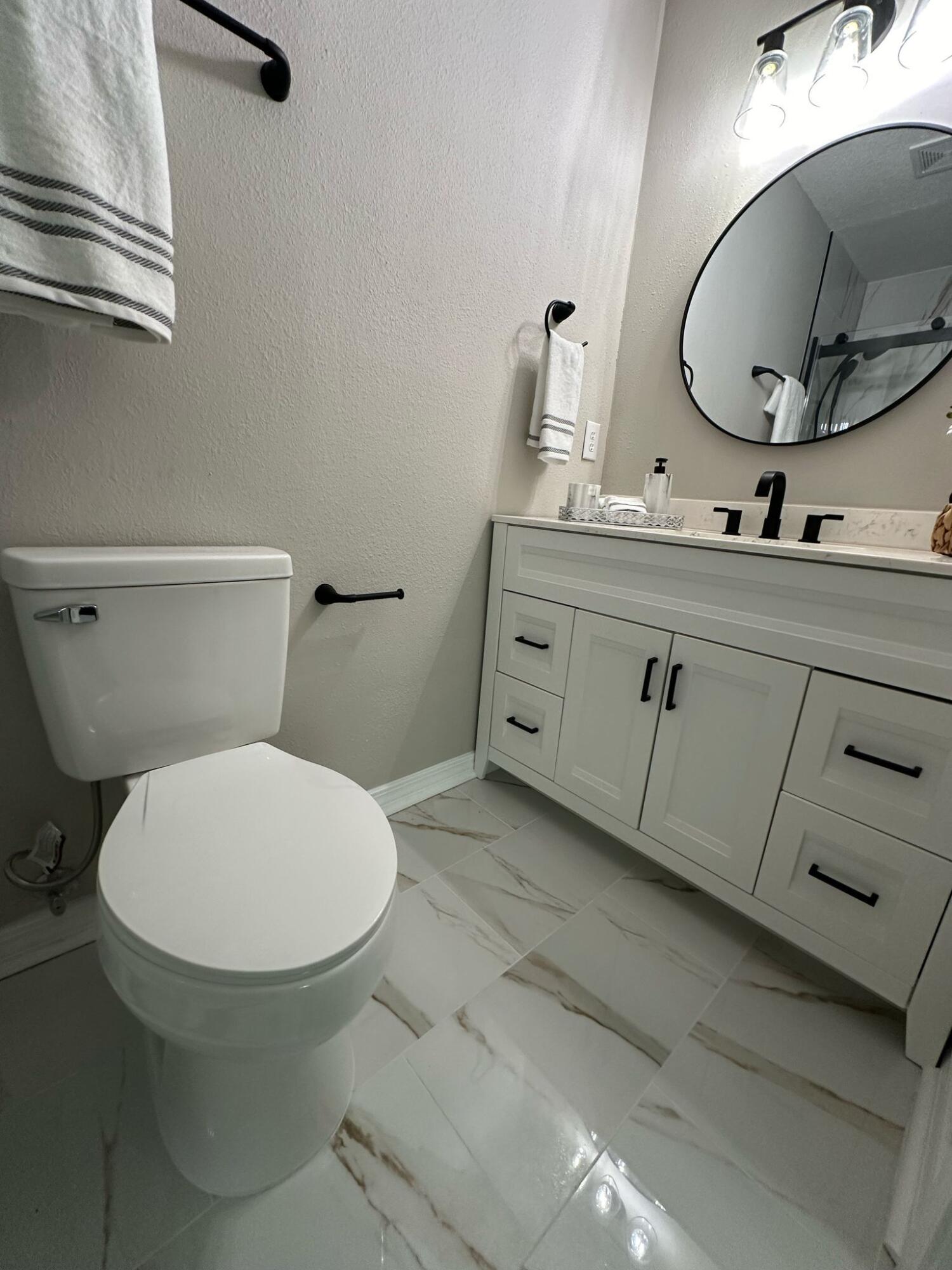1 Kelly Way Valparaiso, FL 32580 - Photo 7 of 18 a bathroom with a toilet sink and mirror