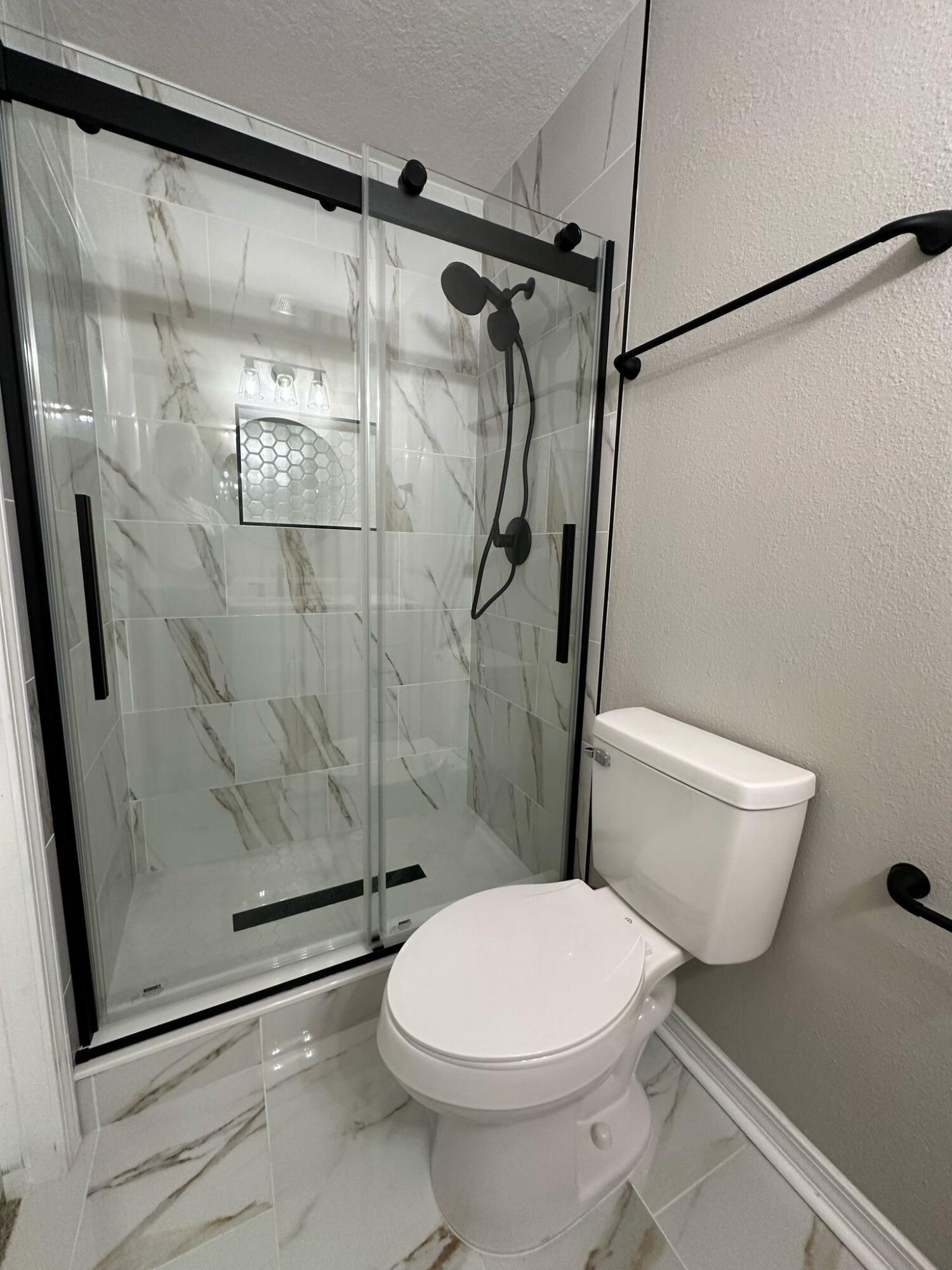 1 Kelly Way Valparaiso, FL 32580 - Photo 8 of 18 a white toilet sitting next to a shower