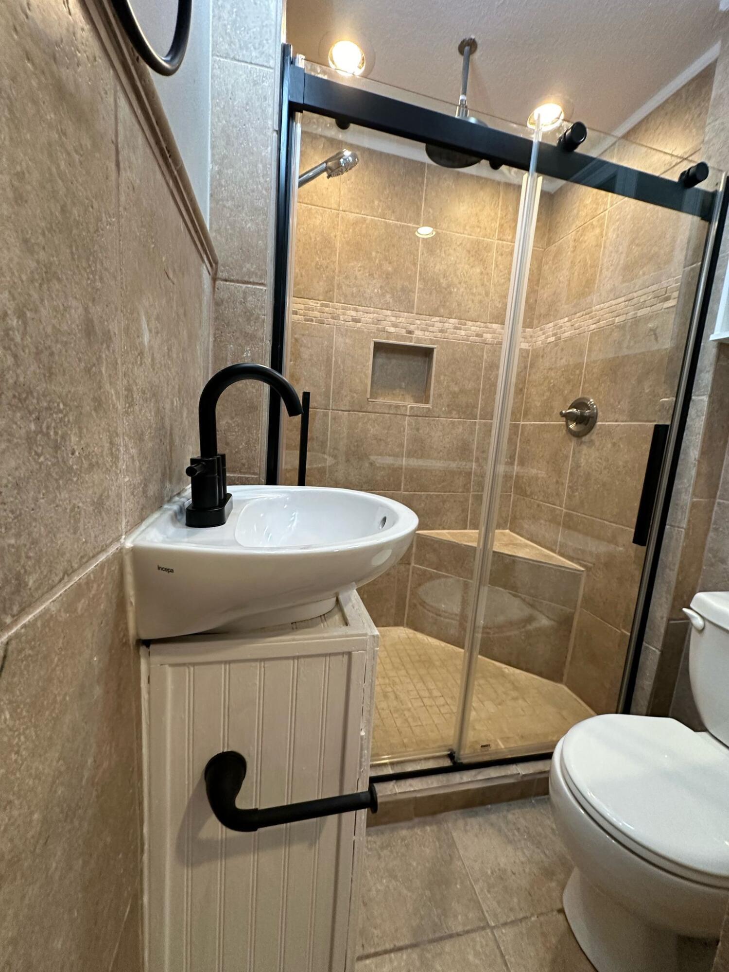 1 Kelly Way Valparaiso, FL 32580 - Photo 9 of 18 a bathroom with a sink toilet and shower