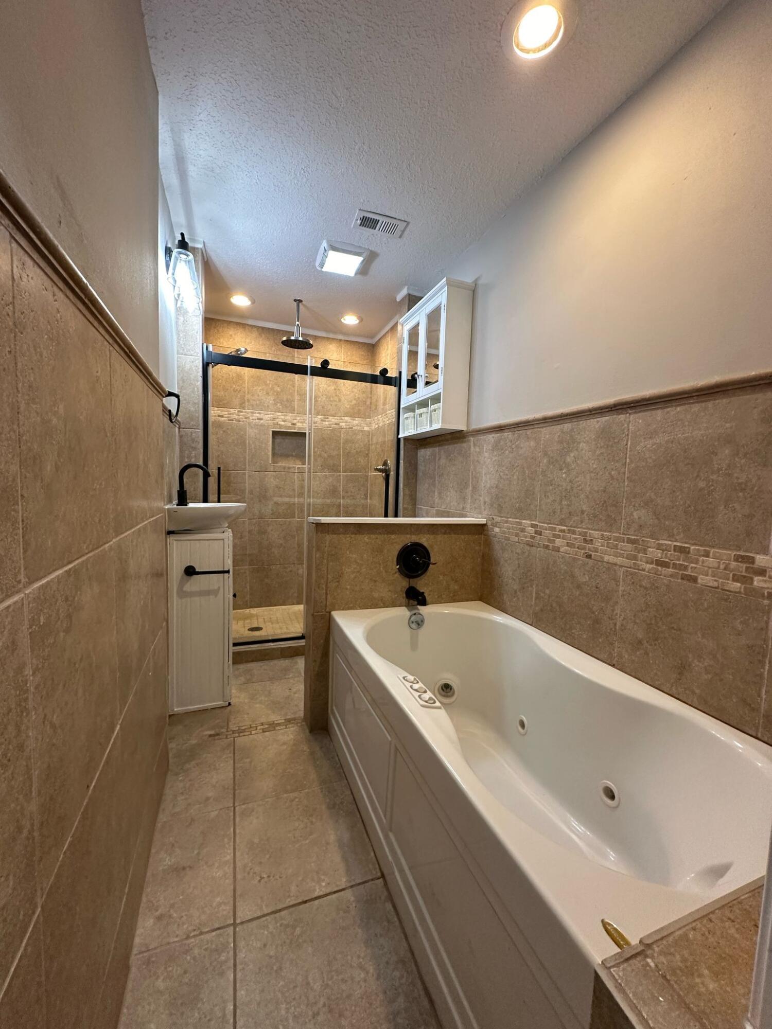 1 Kelly Way Valparaiso, FL 32580 - Photo 10 of 18 a bathroom with a bathtub and a shower