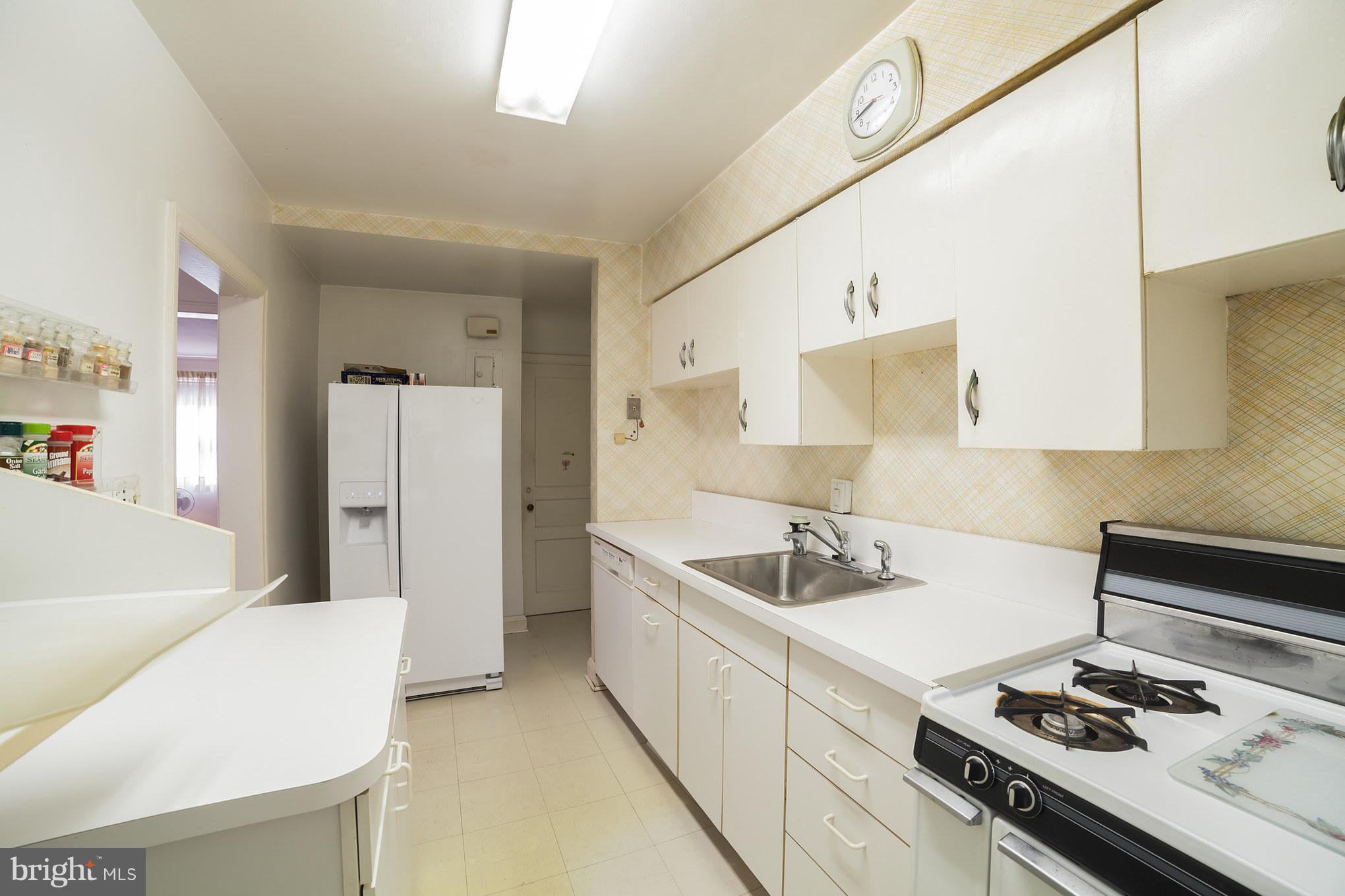 3908 Clarinth Road Baltimore, MD 21215 - Photo 12 of 23 a kitchen with sink and stove