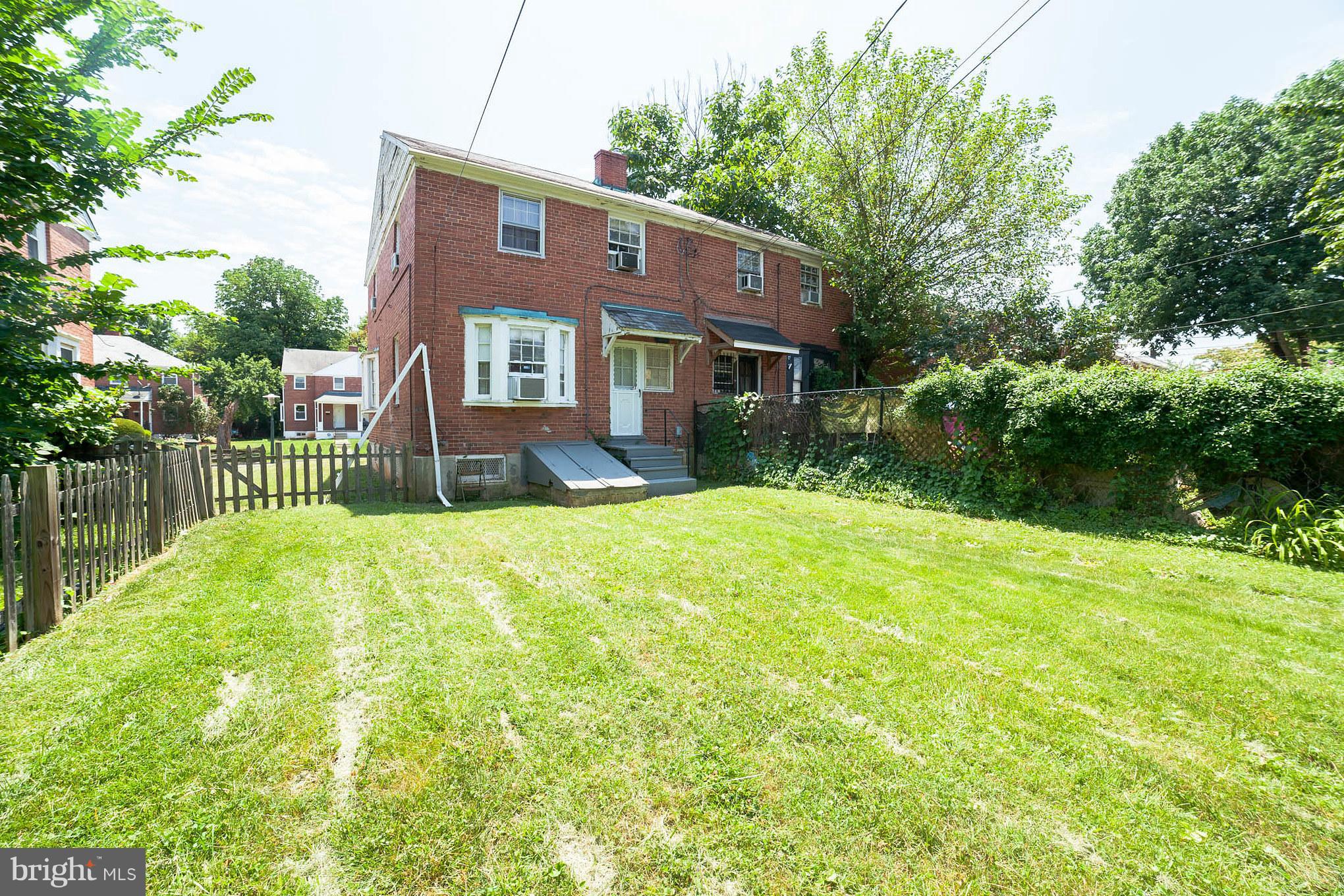 3908 Clarinth Road Baltimore, MD 21215 - Photo 22 of 23 a view of a house with a yard and plants